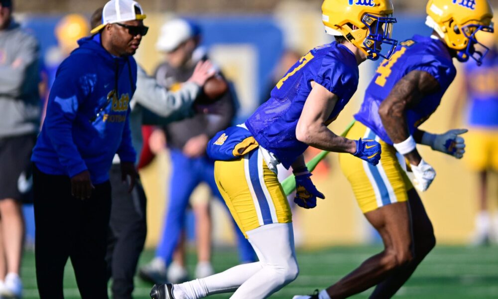 Pitt wide receivers coach JJ Laster (left) coaches up his receivers during spring camp. March 13, 2025 / Ed Thompson. PSN.