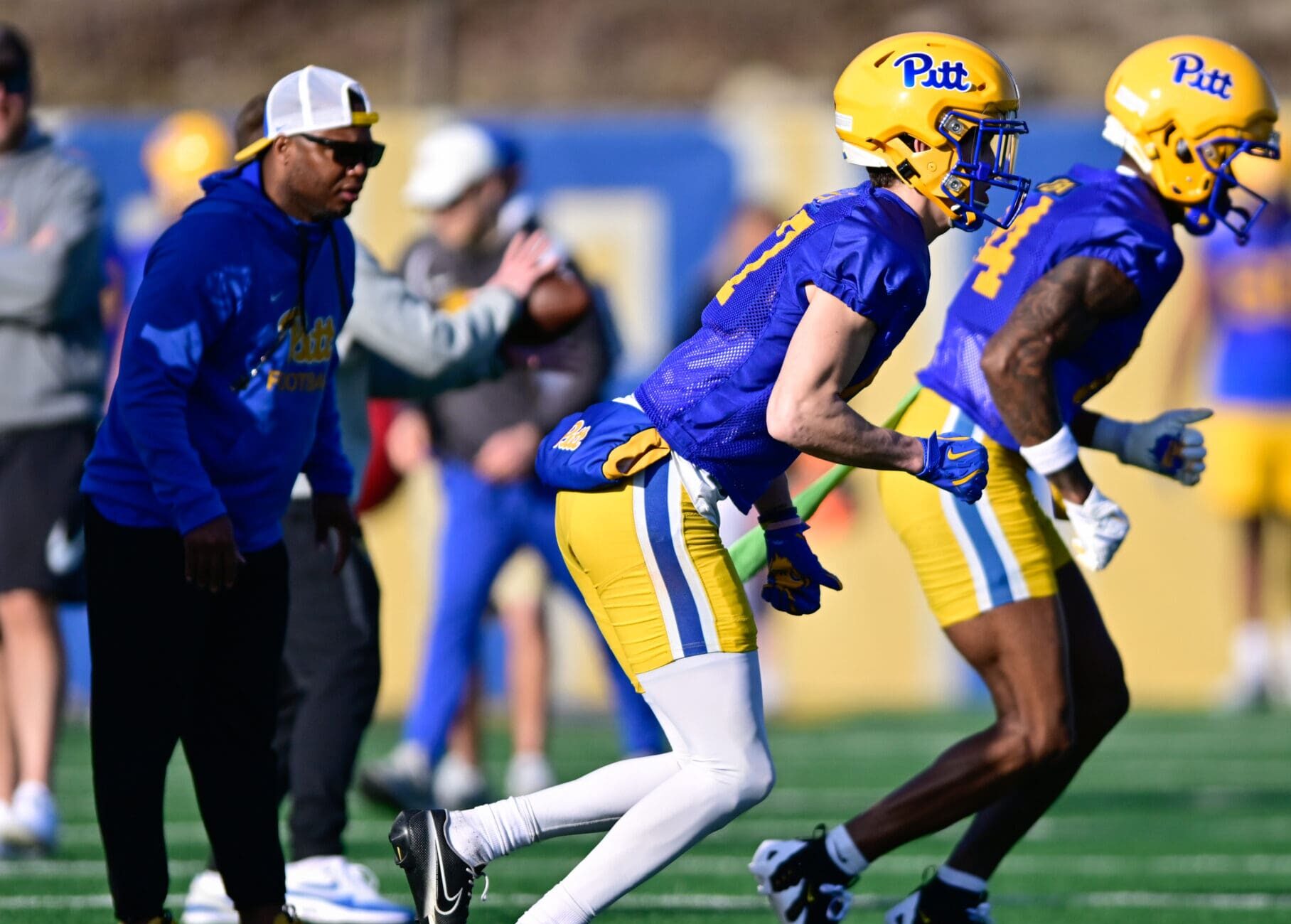 Pitt wide receivers coach JJ Laster (left) coaches up his receivers during spring camp. March 13, 2025 / Ed Thompson. PSN.