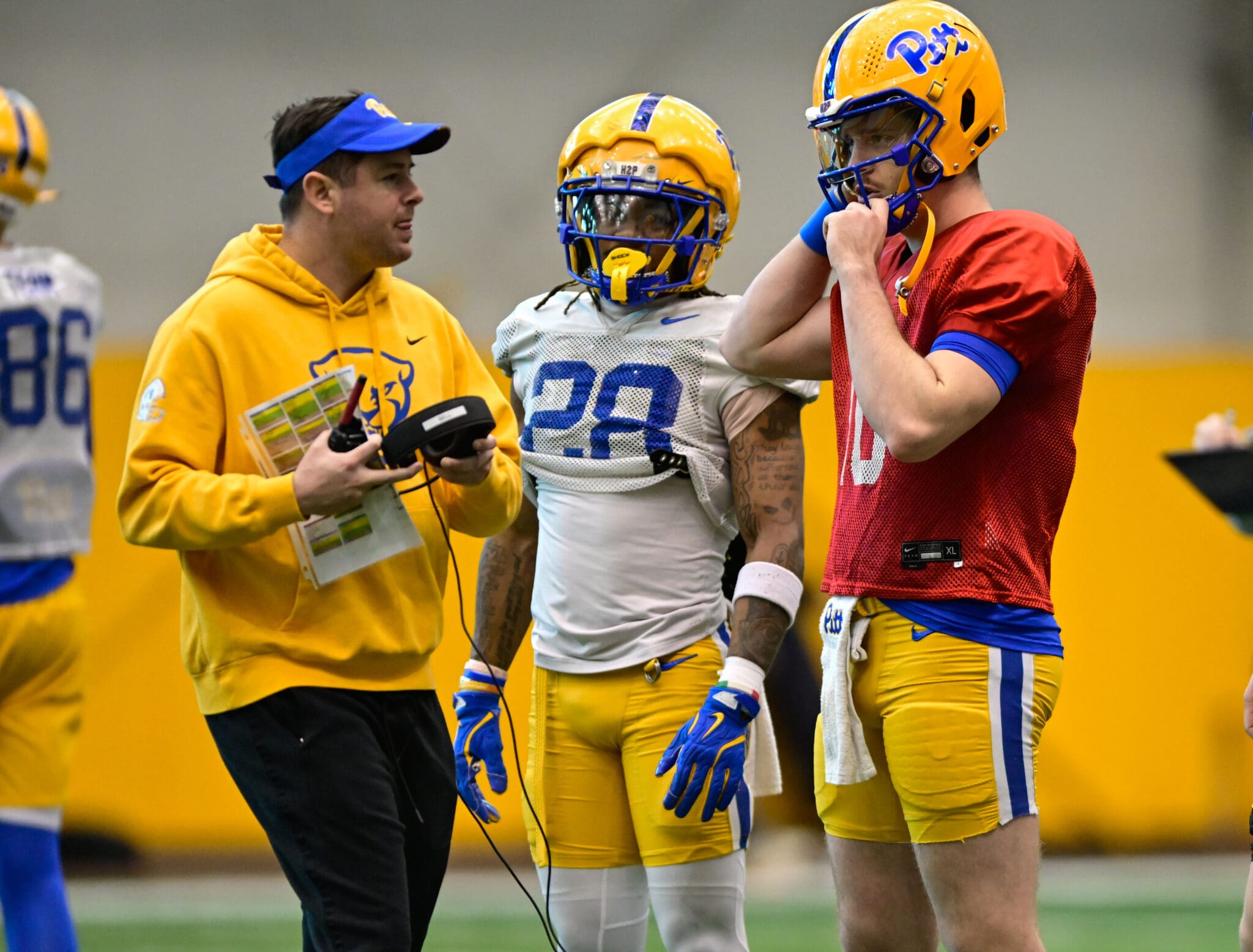 Pitt quarterback Eli Holstein (10) with running back Justin Cook (28) and offensive coordinator. March 27, 2025 / Ed Thompson. PSN.