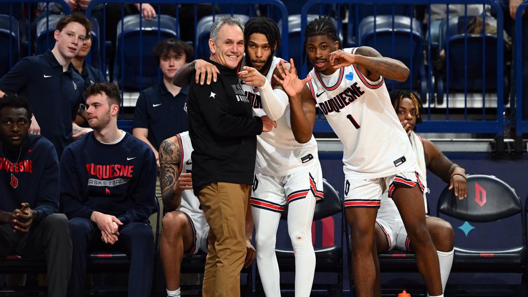 Duquesne Basketball. Jimmy Clark III and Dae Dae Grant with HC Keith Dambrot