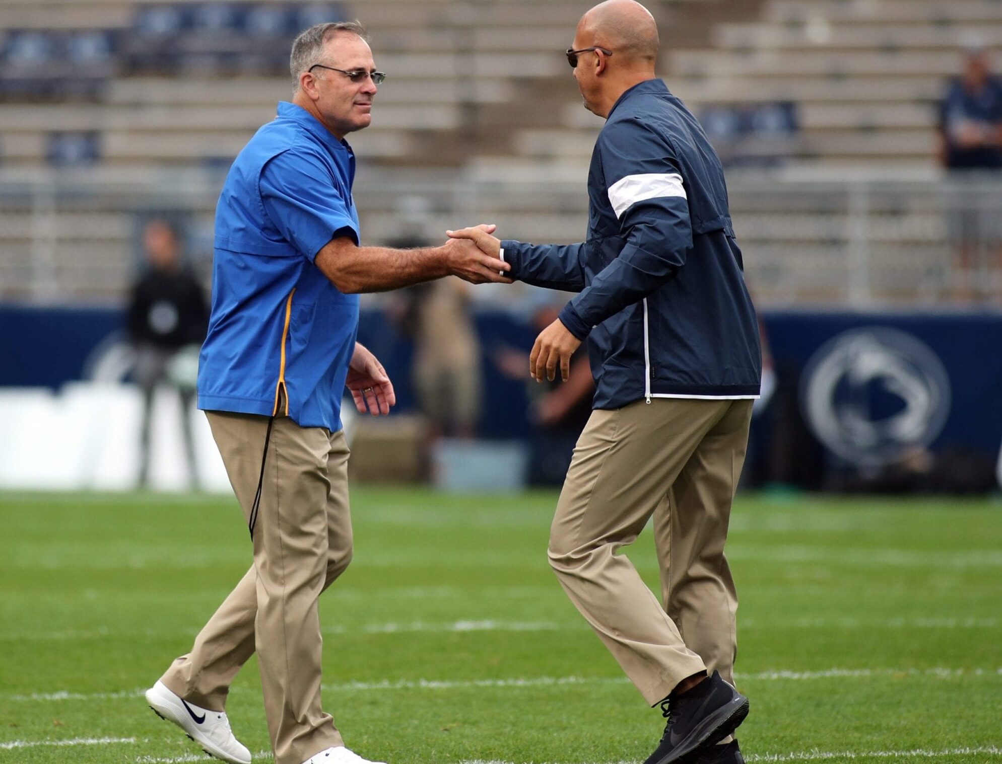 Pitt football head coach Pat Narduzzi and Penn State football head coach James Franklin shake hands