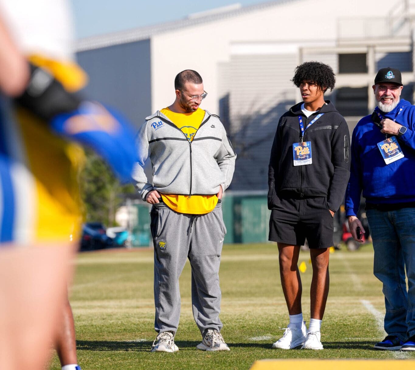 Anthony Johnson with recruits at spring practice. Photo courtesy of Pitt Athletics.