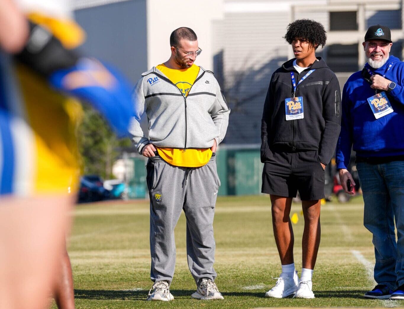 Anthony Johnson with recruits at spring practice. Photo courtesy of Pitt Athletics.