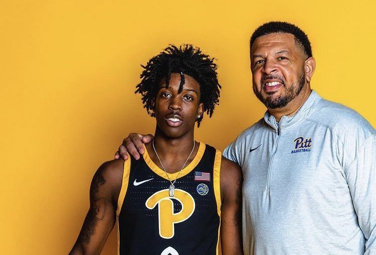 Ty-Laur Johnson poses with Pitt basketball head coach Jeff Capel.