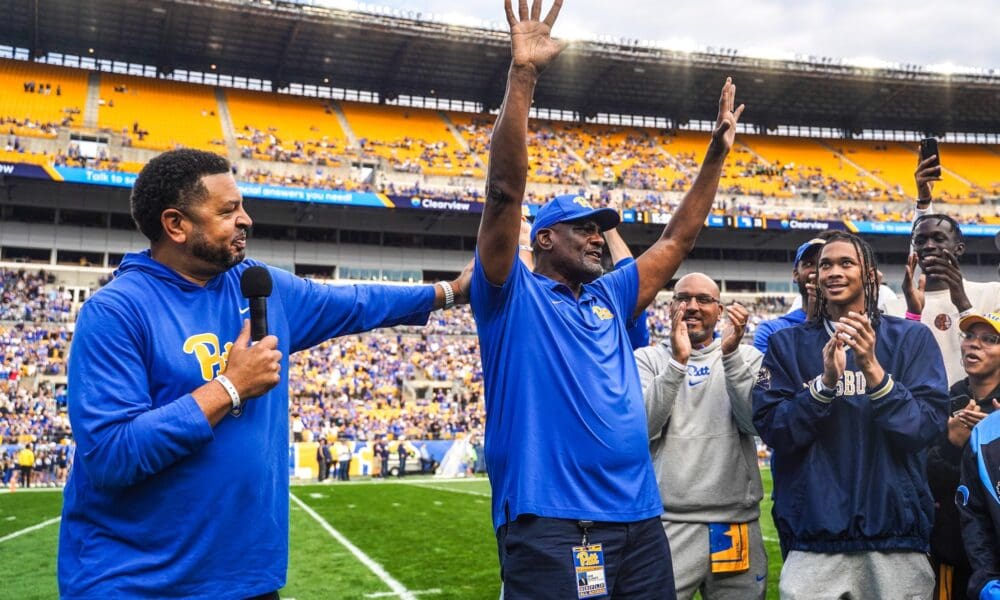 Pitt head coach with legendary Panther Sam Clancy at the Pitt football game on Oct. 12 against California. Pitt will retire Clancy's No. 15 jersey this year.