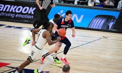 Duquesne forward Matus Hronsky brings the ball up the court against st. Bonaventure in the A-10 Championship -- Duquesne Athletics