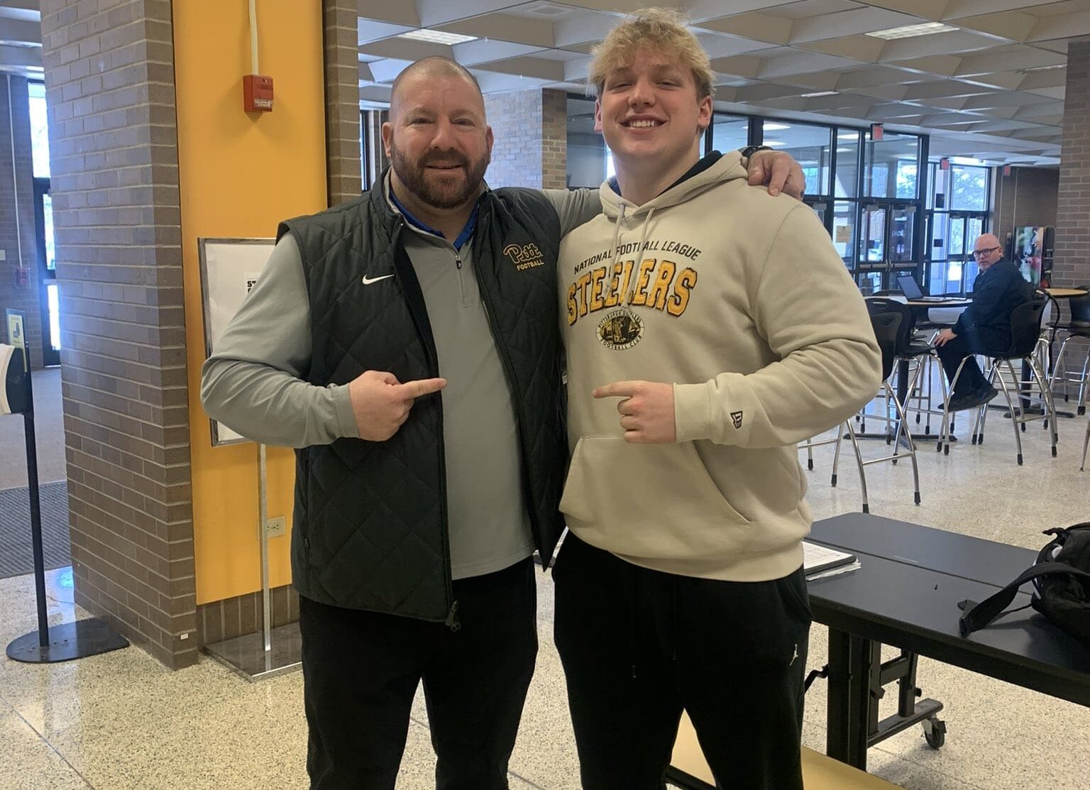 Pitt commit Lincoln Hoke with defensive line coach Tim Daoust. Photo courtesy of Hoke's X account.