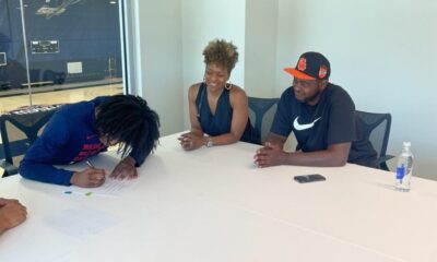 Washington Wizards guard Carlton "Bub" Carrington signs first NBA contract alongside family. Photo via Carrington family.