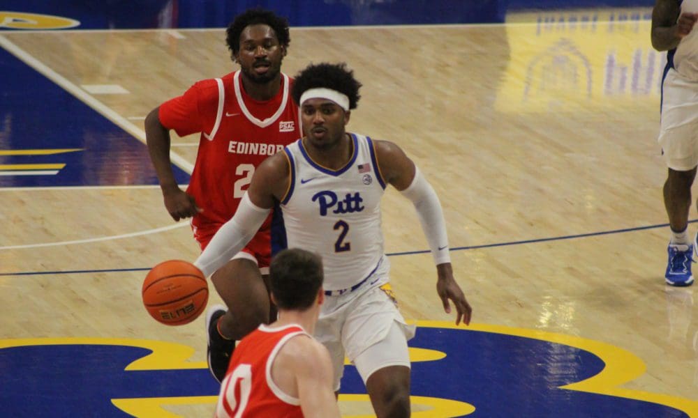 Blake Hinson Pitt basketball dribbles a ball in a win over Edinboro.