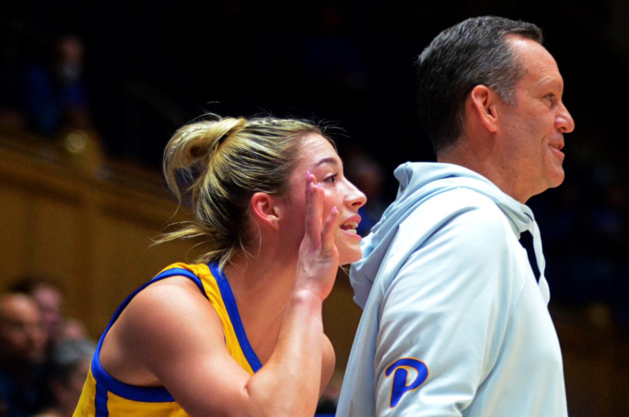 Marley Washenitz stands next to Pitt coach Lance White and calls out to her teammates at Duke on Feb. 2, 2023. (Mitchell Northam / Pittsburgh Sports Now)