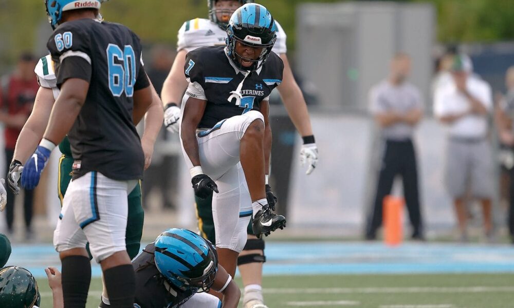 Zykir Moore (7) of Woodland Hills celebrate a tackle against Penn-Trafford. September 8, 2023 -- Jared Todhunter/PSN