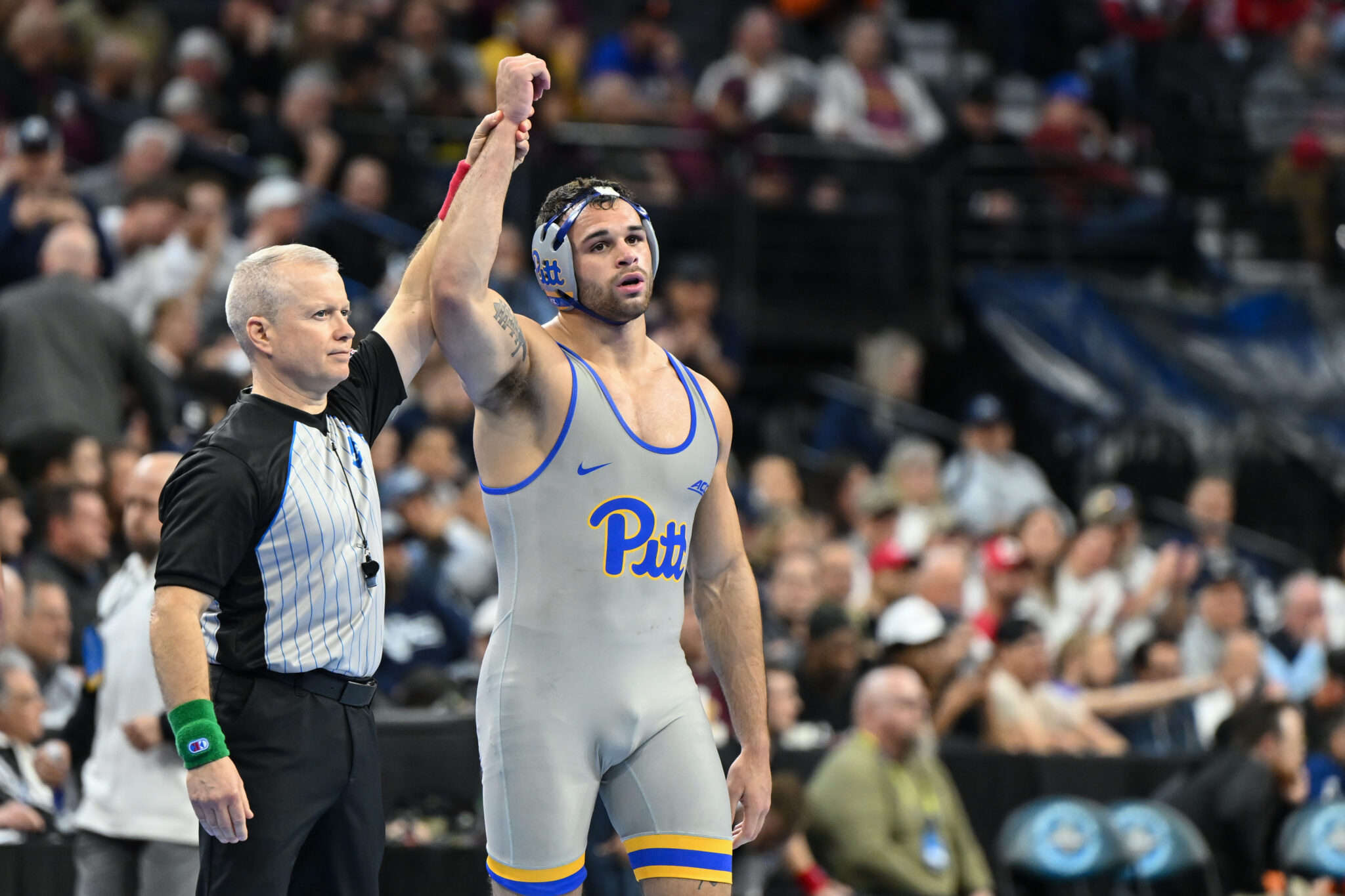 Mac Stout of Pitt defeats brother Luke Stout of Princeton at NCAA championships. Photo courtesy of Pitt Athletics.